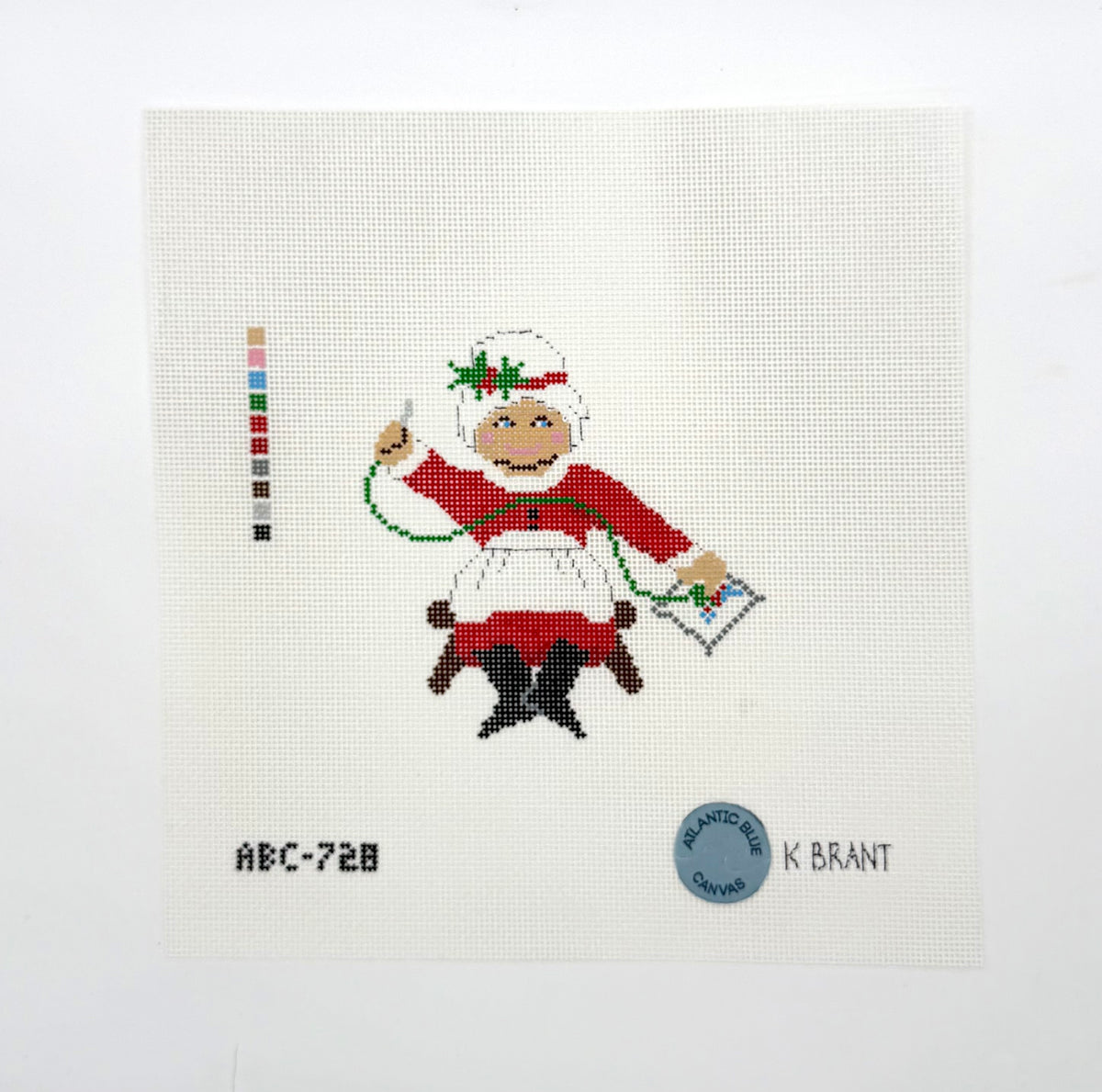 Needlepointing Mrs. Claus