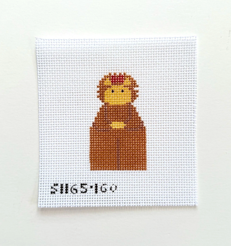 A square white needlepoint canvas featuring a pixelated cartoon character in brown, yellow, and red, with the black text 'SH65160' at the bottom, displayed against a plain off-white background.
